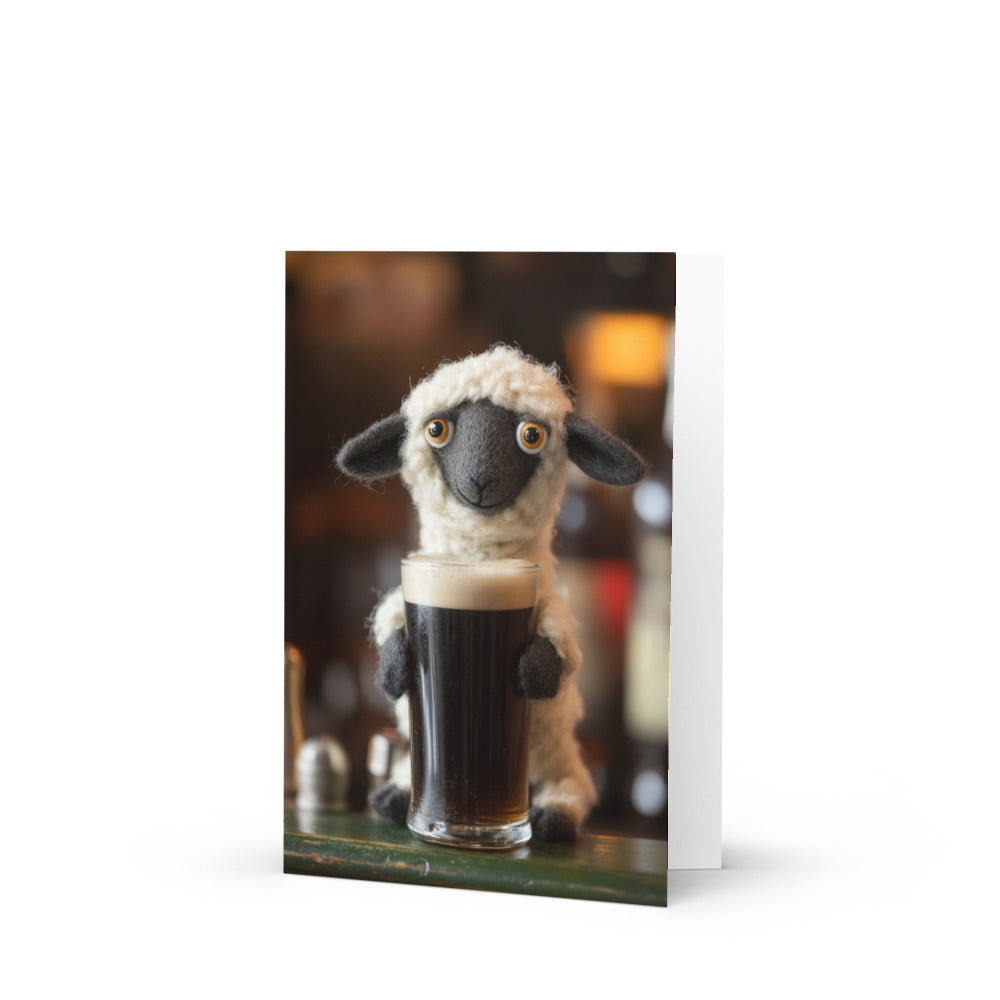 A whimsical felted sheep greeting card featuring a sheep holding a pint of Irish stout in a cozy pub setting, perfect for craft beer lovers and unique card collectors.