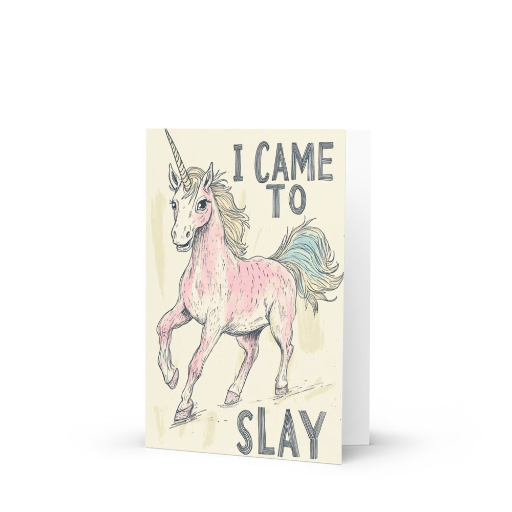 A lighthearted sketch of a pink unicorn with a flowing mane and the phrase 'I CAME TO SLAY' on a cheerful backdrop, perfect for whimsical greeting card lovers who enjoy humor and creativity.
