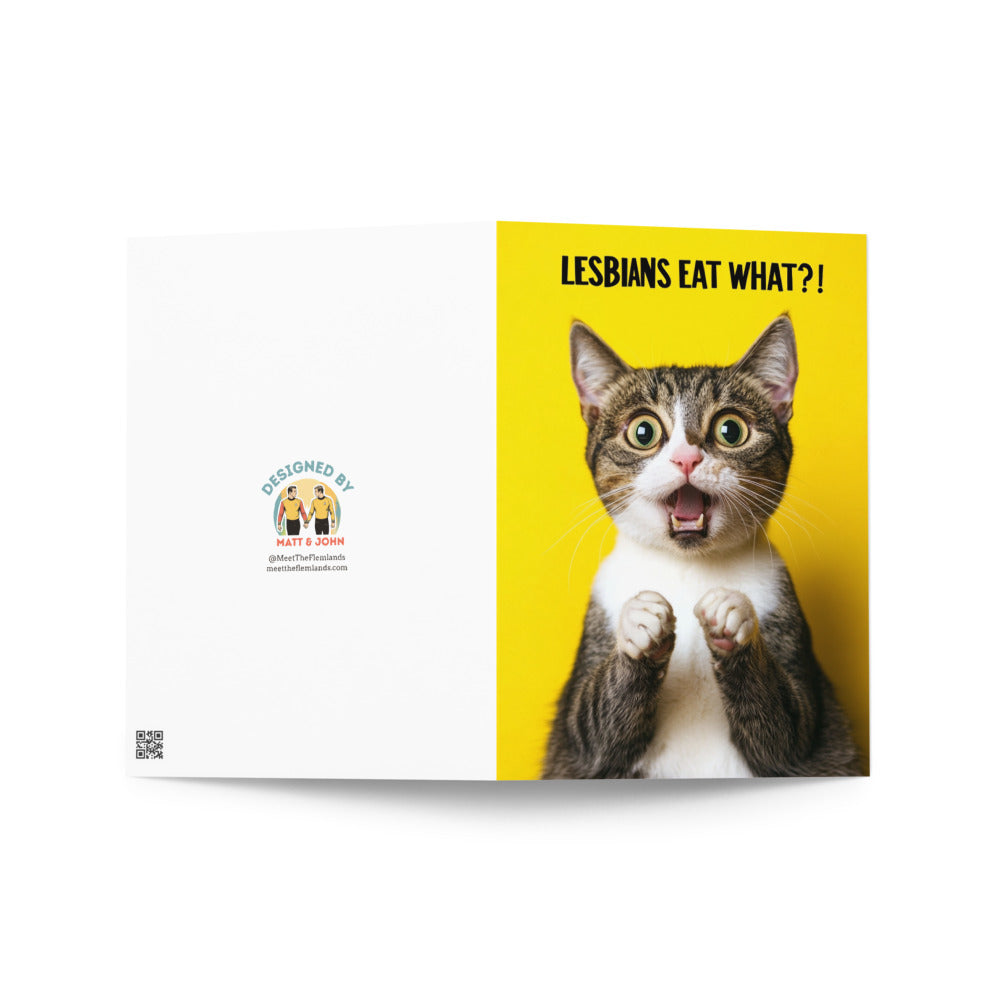 Front artwork of a humorous LGBTQ+ greeting card with a shocked cat and the phrase 'LESBIANS EAT WHAT?!', perfect for celebrating pride and friendship.