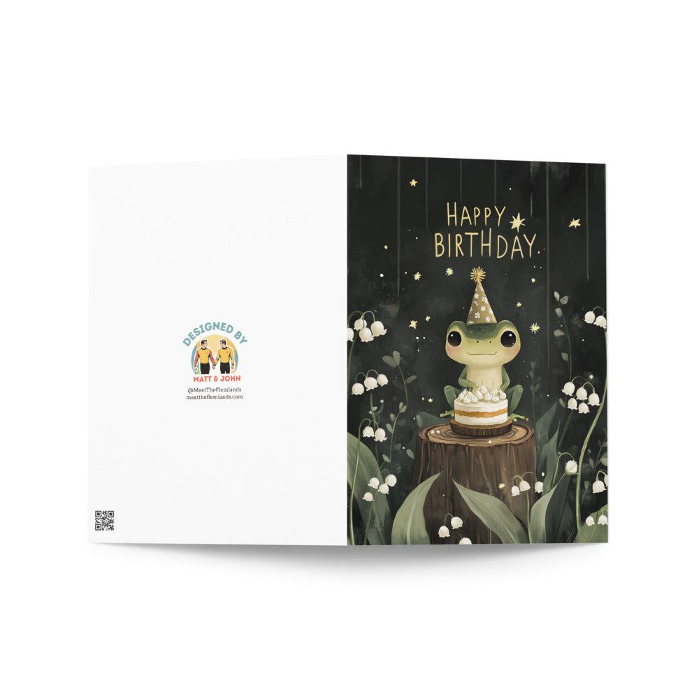 Kawaii frog birthday card design showcasing an adorable frog in party attire with cake, nestled among lily of the valley flowers, perfect for any whimsical occasion or gift for animal lovers.