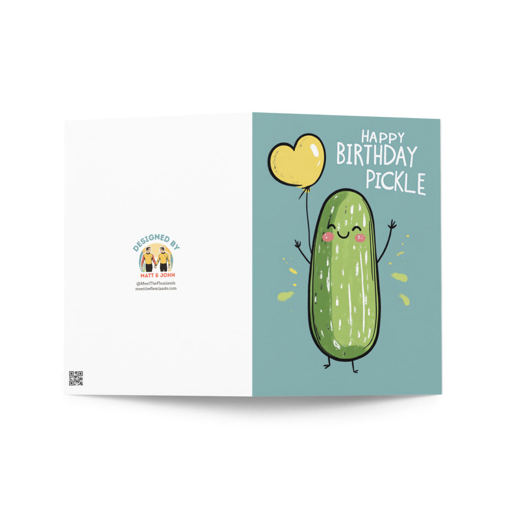 Cute pickle character holding a heart-shaped balloon on a birthday card, beautifully illustrated against a soft blue background for a fun and quirky touch.