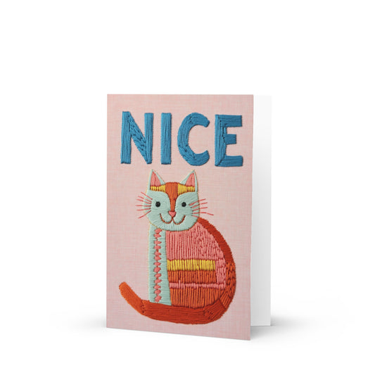 Whimsical embroidered cat greeting card featuring playful blue 'NICE' text on a light pink background, inspired by Matisse's artistic style, perfect for cat lovers.