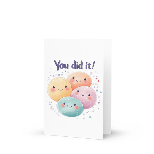 A vibrant 'You Did It!' celebratory greeting card featuring four colorful, smiling characters in pastel hues, perfect for congratulating friends on their achievements, suitable for graduations and special milestones.