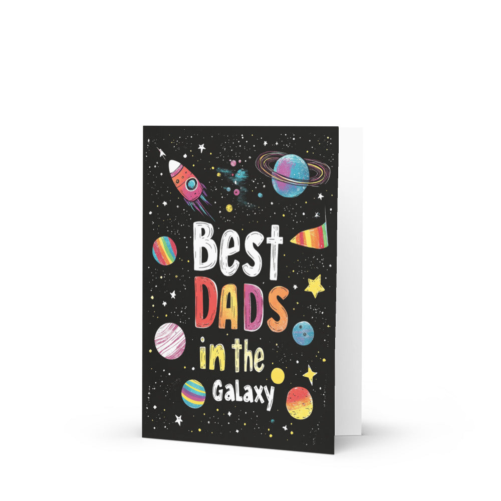 Vibrant greeting card showcasing 'Best Dads in the Galaxy' with colorful planets and a rocket, perfect for celebrating gay dads on Father's Day or pride events.