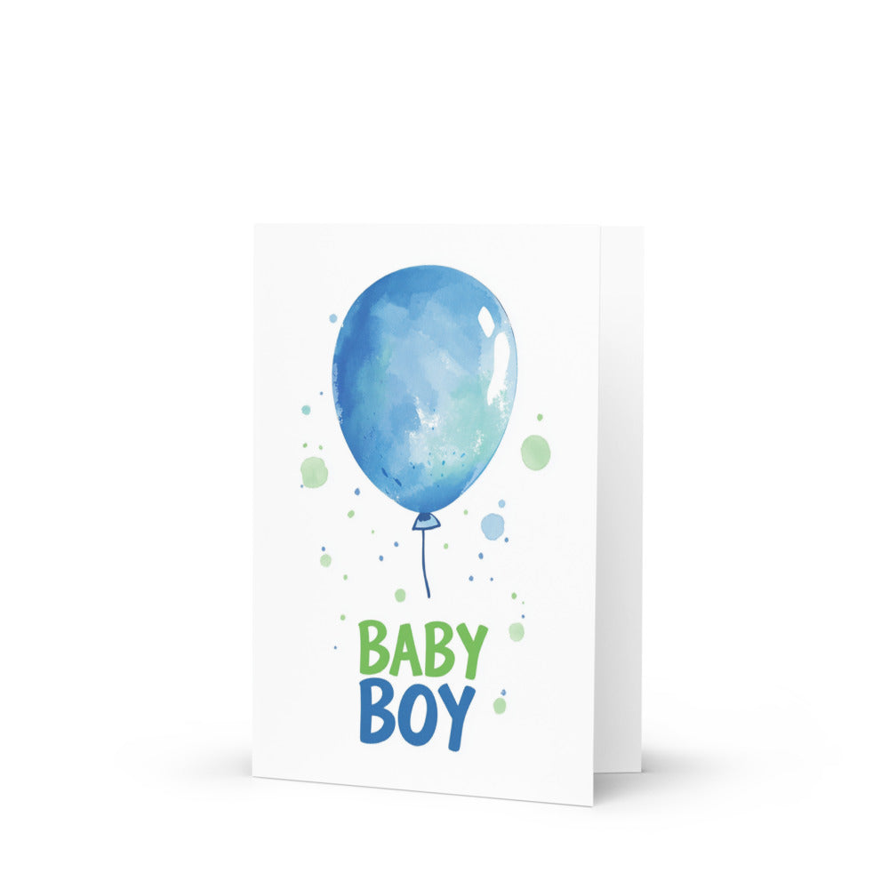 Charming Baby Boy Balloon Greeting Card featuring a whimsical blue balloon with 'BABY BOY' text in vibrant green, perfect for celebrating new life with a clean white background and pastel watercolor accents.