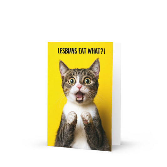 Funny lesbian greeting card featuring a shocked cat with the text 'LESBIANS EAT WHAT?!' on a vibrant yellow background, perfect for LGBTQ+ birthday celebrations and humor.