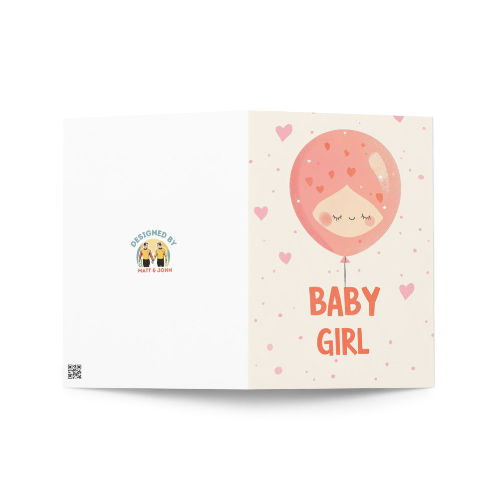 Adorable baby girl card with a cartoon balloon head design and cheerful colors, ideal for gifting at baby showers, new baby celebrations, or birth announcements.